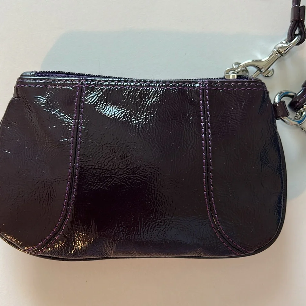 EUC Coach patent leather wristlet in dark purple or plum color and silver metal - Picture 5 of 10